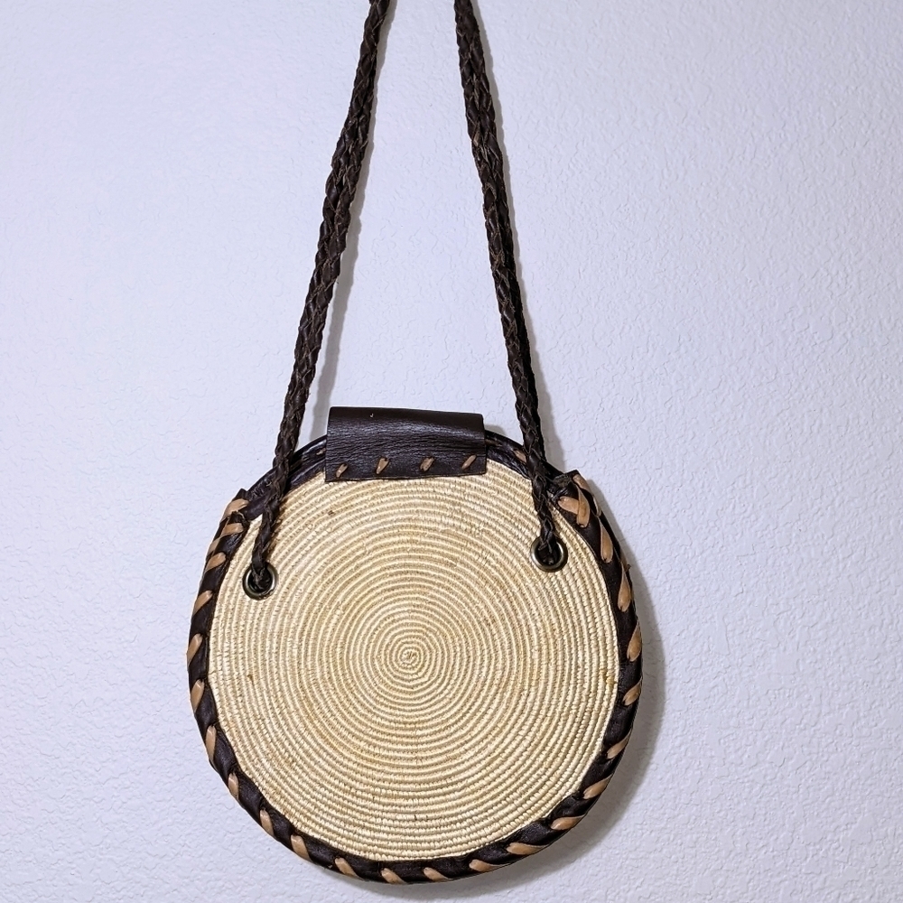 Handwoven Round Straw Crossbody with a Dark Leather Strap and Flap - Picture 2 of 4